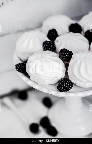 Meringue Cookies Witj Blackberries On Rustic Background Stock Photo