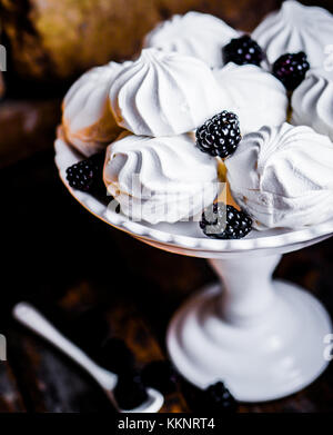 Meringue Cookies Witj Blackberries On Rustic Background Stock Photo