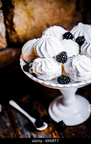 Meringue Cookies Witj Blackberries On Rustic Background Stock Photo