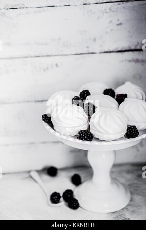 Meringue Cookies Witj Blackberries On Rustic Background Stock Photo