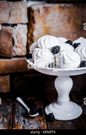 Meringue Cookies Witj Blackberries On Rustic Background Stock Photo