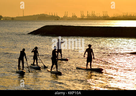 Stand up paddle surfing and stand up paddle boarding (SUP) Stock Photo