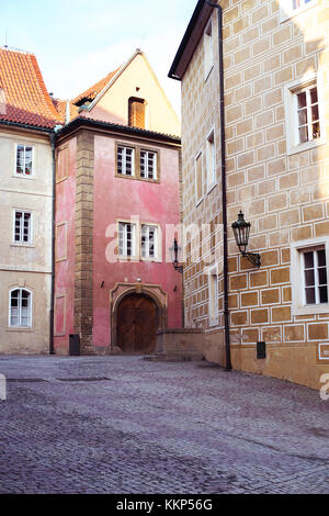 A tiny narrow street with old traditional buildings in Mala Strana around Prague Castle. Stock Photo