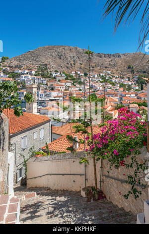 Narrow street with a hilltop view over the town, Hydra, Saronic Islands, Greece Stock Photo