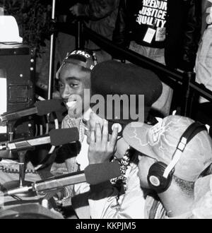 The Digital Underground (with Tupac Shakur) doing an interview at the KMEL Summer Jam at the Shorline Ampitheatre in Mountain View, CA.  August, 1991. Credit: Pat Johnson/MediaPunch Stock Photo