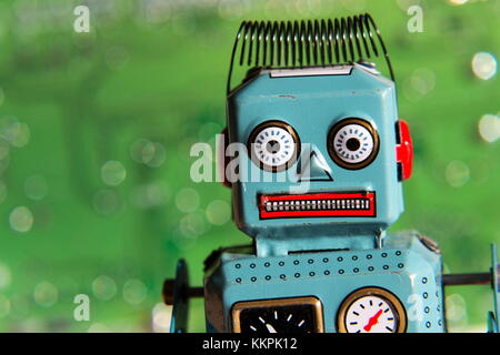 Vintage tin toy robot with computer board, artificial intelligence concept Stock Photo