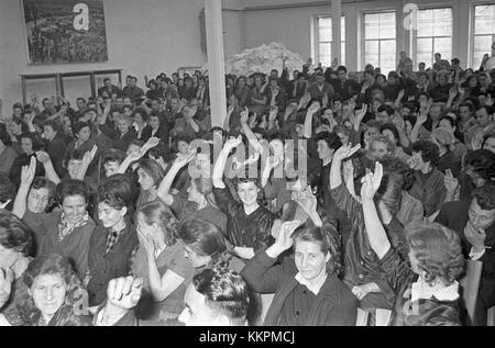This title refers to a workers' assembly at MTT (Motorno tovarno Triglav), which took place in 1963. MTT was an industrial factory located in Slovenia, formerly part of Yugoslavia. This assembly involved workers discussing factory conditions, labor rights, and other important issues in the post-war era, contributing to the social landscape of the time. Stock Photo