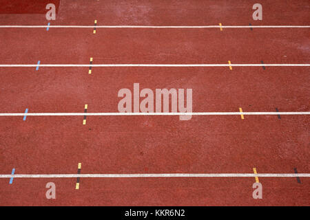 close-up and diagonal perspective to 100 m track in a stadium with markings. Stock Photo