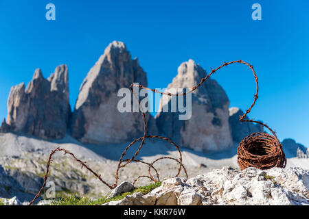 Sesto / Sexten, province of Bolzano, Dolomites, South Tyrol, Italy. Barbed wire from the First World War in front of the Three Peaks of Lavaredo Stock Photo