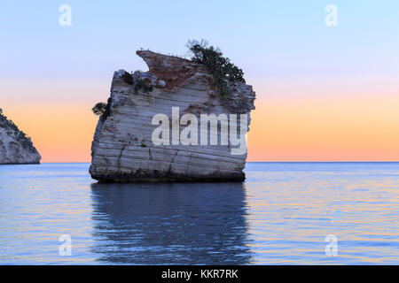 Sunset to the Faraglioni of Baia delle Zagare, Mattinata, Apulia(pUglia), Italy. Stock Photo