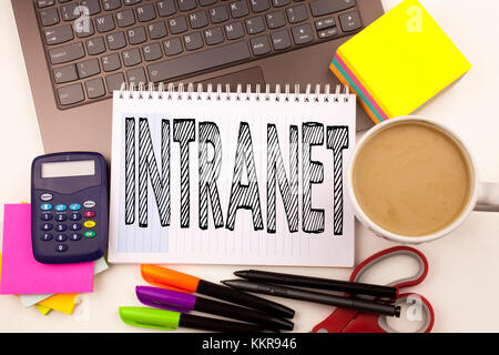 Word writing Intranet word cloud in the office with laptop, marker, pen, stationery, coffee. Business concept for Internet Network Technology Workshop Stock Photo