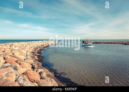 Fishing boat in the harbor of the little danish village Aalbæk near Skagen in the Area of Kattegat Stock Photo