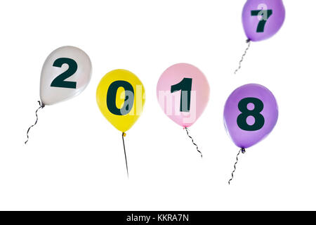 New year 2018 written on coloured balloons flying on white background Stock Photo