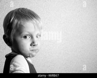 4-year-old Caucasian boy builds fanny face Stock Photo