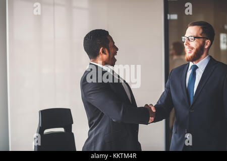 two business men shaking hands in meeting. great deal concept Stock Photo