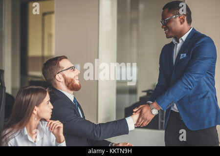 Business people shaking hands, finishing up a meeting Stock Photo