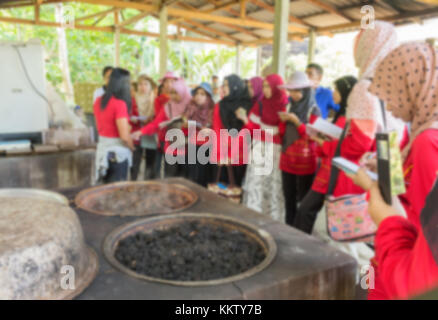Blurred abstract background of university students Learning outside the classroom, in the  to  Dye fabric of community. Stock Photo