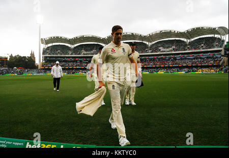 England's Chris Woakes walks off due to rain during day one of the Ashes Test match at the Adelaide Oval, Adelaide. Stock Photo