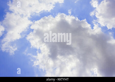 sky is covered by white clouds and raincloud.(may be used as background) Stock Photo