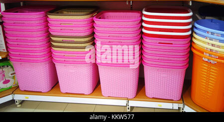 Plastic baskets on a shelf Stock Photo