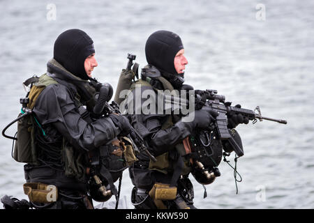 DEN HELDER, THE NETHERLANDS - JUN 23, 2013: Special Forces combat diver during an amphibious assault demo at the Dutch Navy Days. Stock Photo