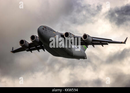 LEEUWARDEN, THE NETHERLANDS - MAY 5, 2015: US Air Force Boeing C-17 Globemaster III transport plane taking off from Leeuwarden Airbase. Stock Photo