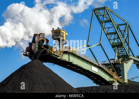 Stacker-reclaimer in a coal handling terminal. Stock Photo