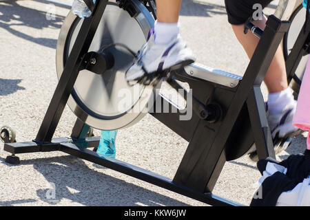 Legs moving during a workout of spinning. Stock Photo