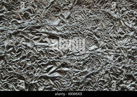 frontal photograph of aluminium foil crumpled kitchen. Stock Photo