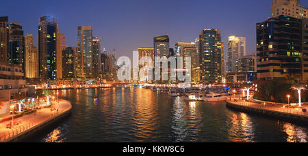 Night cityscape of Dubai. Marina bay district in Dubai at night. Stock Photo