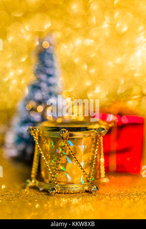 Christmas decoration on golden sparkling background. Macro photo Stock Photo