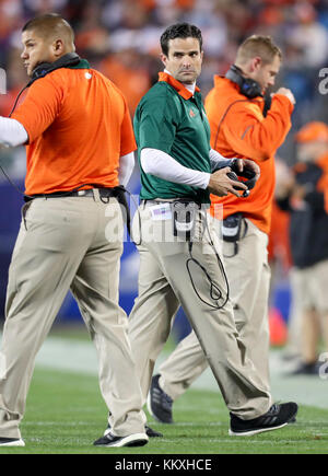 Miami Defensive Coordinator Manny Diaz, Left, Gives Instructions To The 