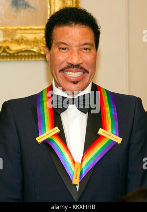 Washington DC, USA. 2nd December, 2017. Lionel Richie, one of he five recipients of the 40th Annual Kennedy Center Honors with his award as he poses for a group photo following a dinner hosted by United States Secretary of State Rex Tillerson in their honor at the US Department of State in Washington, DC on Saturday, December 2, 2017. The 2017 honorees are: American dancer and choreographer Carmen de Lavallade; Cuban American singer-songwriter and actress Gloria Estefan; ; American television writer and producer Norman Lear; and American Credit: MediaPunch Inc/Alamy Live News Stock Photo