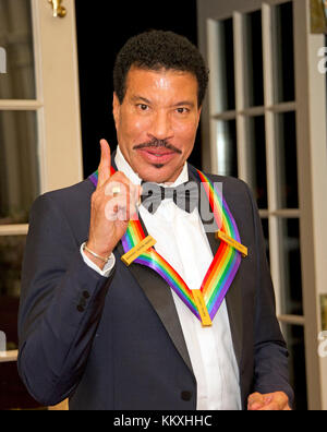 Washington DC, USA. 2nd December, 2017. Lionel Richie, one of he five recipients of the 40th Annual Kennedy Center Honors with his award as he poses for a group photo following a dinner hosted by United States Secretary of State Rex Tillerson in their honor at the US Department of State in Washington, DC on Saturday, December 2, 2017. The 2017 honorees are: American dancer and choreographer Carmen de Lavallade; Cuban American singer-songwriter and actress Gloria Estefan; ; American television writer and producer Norman Lear; and American Credit: MediaPunch Inc/Alamy Live News Stock Photo