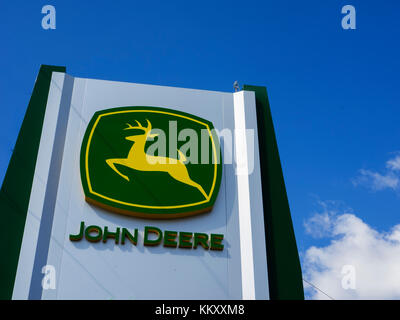 Rivne, Ukraine -  August 31, 2017: John Deere sign on a panel. John Deere is an American corporation that manufactures agricultural, construction, and Stock Photo