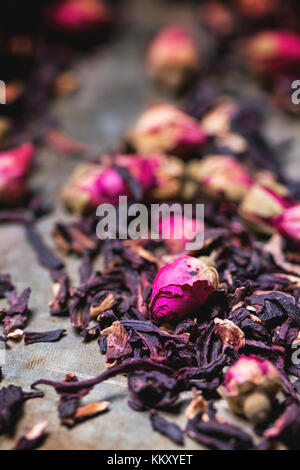 Heap of tea roses and dried hibiscus flower Stock Photo
