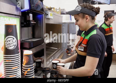 Staff of 500th Burger King restaurant in Russia preparing coffee in the day of opening Stock Photo