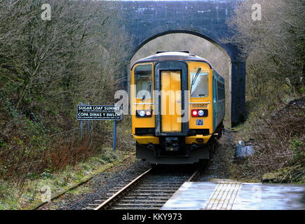 The Arriva Trains Wales service to Swansea departs from Sugar Loaf railway station, the most remote station on the Heart of Wales Line, situated by th Stock Photo