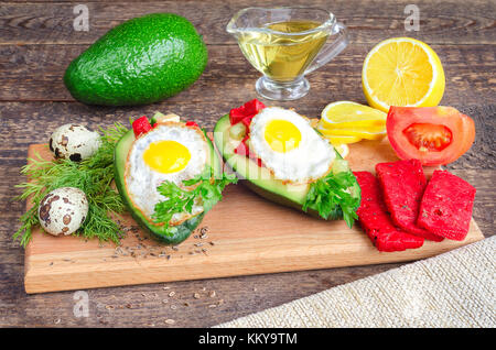 Salad with avocado, quail eggs and red tomato cheese Stock Photo