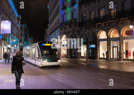 STRASBOURG FRANCE - NOVEMBER 27 2017: French tramway going to Central Train station with the Traditional Christmas market in the historic Strasbourg A Stock Photo