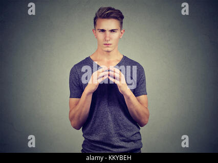 Sly young man looking at camera Stock Photo