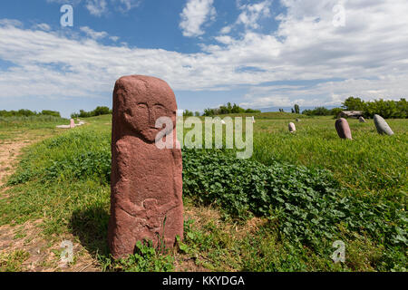 Balbas known as stone warriors, in the ruins of the ancient site of Balasagun known also as Burana Tower in Kyrgyzstan. Stock Photo