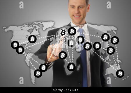 A Man Global Bitcoin transmission via blockchain Stock Photo