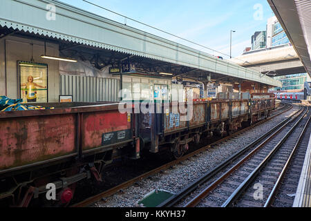 LONDON CITY - DECEMBER 26, 2016: Wagons on a freight train parked at Paddington Station for picking up scrap Stock Photo