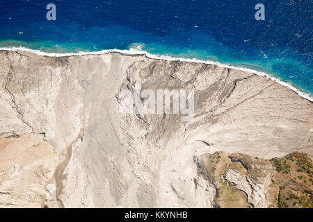 The remains of recent pyroclastic flows of the Soufriere Hills Volcano form the east coast of Montserrat. Aerial view from helicopter. You can see fre Stock Photo