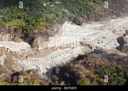 The remains of recent pyroclastic flows of the Soufriere Hills Volcano at the  east coast of Montserrat. Aerial view from helicopter. Stock Photo