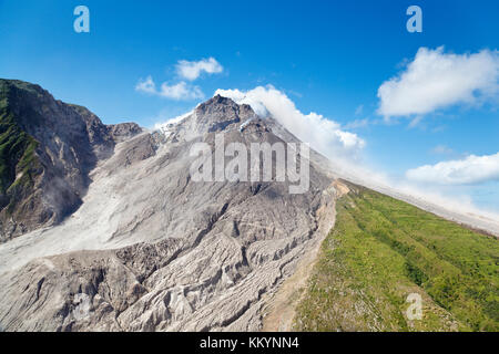 The active Soufriere Hills Volcano in Montserrat seen from helicopter. The dead landscape is frequently covered by new pyroclastic flows. Stock Photo