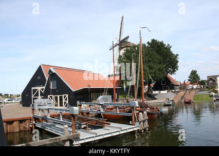 Harderwijk, corn mill De Hoop next to Vissershaven (Fishing Port, nowadays recreational harbour), Harderwijk, The Netherlands. Stock Photo