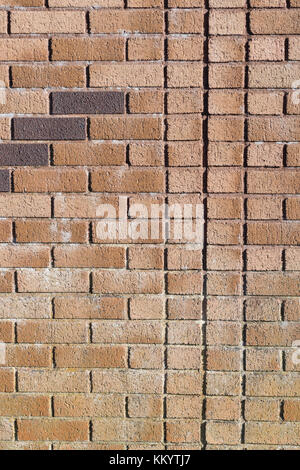 Red brick patterns and lines in bright sunshine - as brickwork abstract or photographic background / backdrop. For UK construction sector. Stock Photo