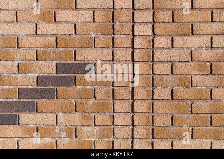 Red brick patterns and lines in bright sunshine - as brickwork abstract or photographic background / backdrop. For UK construction sector. Stock Photo